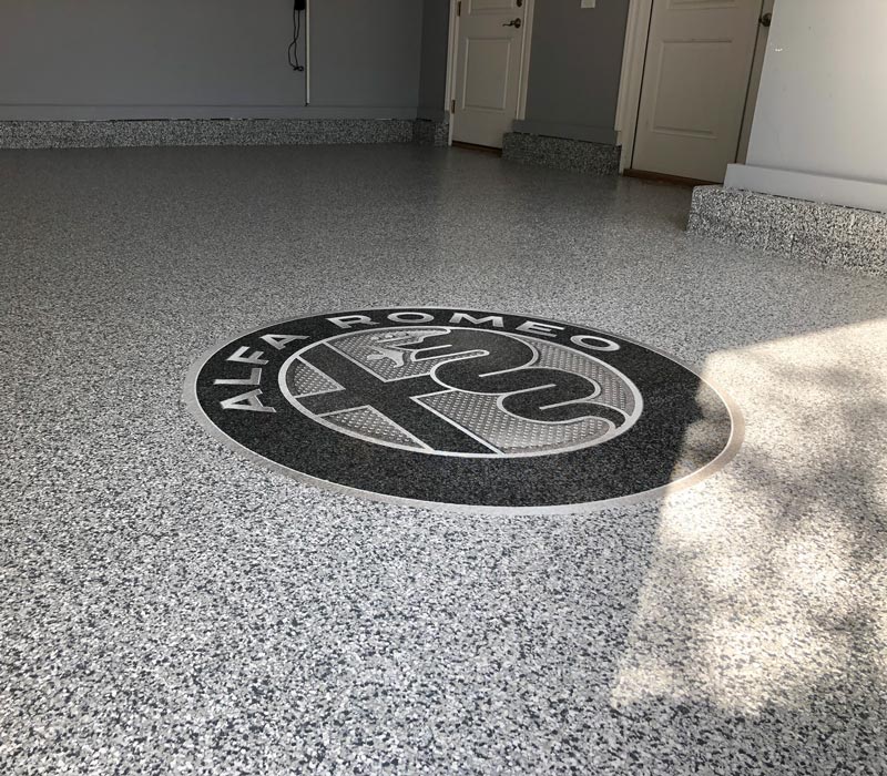 logo installed on epoxy garage floor